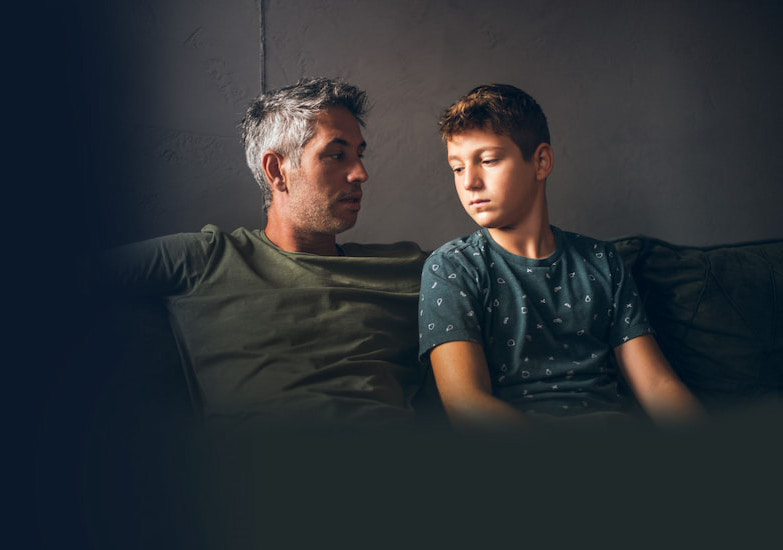 Father talking to son about cancer