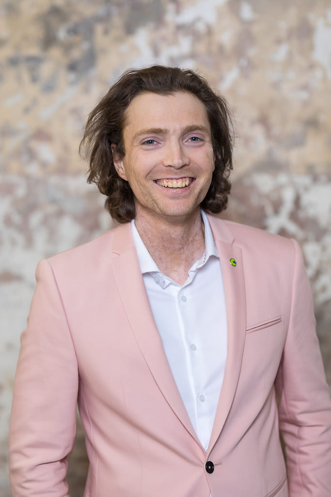 joey lynch who is the chair of the board smiling at the camera and wearing a canteen bandanna on her arm