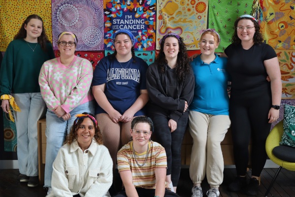 a group of young people impacted by cancer gathering together as part of a grief and cancer support group at canteen